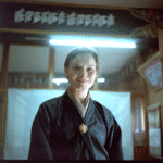 Tierney wears a green kira in an office of the Library