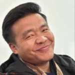 Nima Tshering Smiles looking sideways